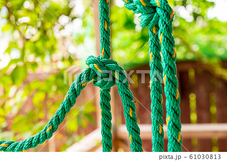 rope nylon green knot tied up close up vertical 61030813