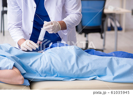 Female patient getting an injection in the clinic Female patient getting an injection in the clinic 61035945