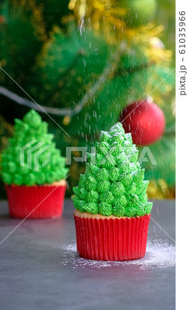 Christmas tree cupcake with powdered sugar. 61035966