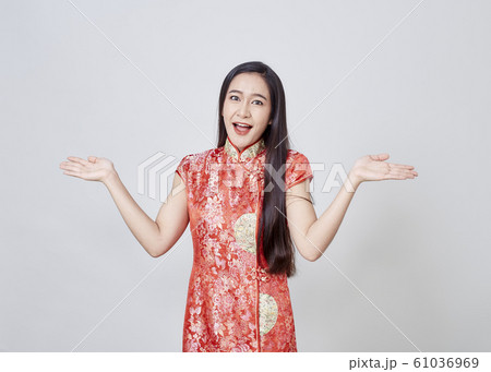 Asian woman in chinese dress traditional cheongsam 61036969