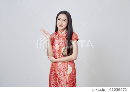 Asian woman in chinese dress traditional cheongsam Asian woman in chinese dress traditional cheongsam 61036972