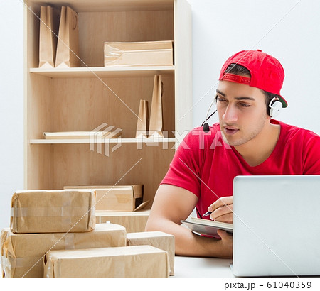 Call center worker at parcel distribution center in post office Call center worker at parcel distribution center in post office 61040359