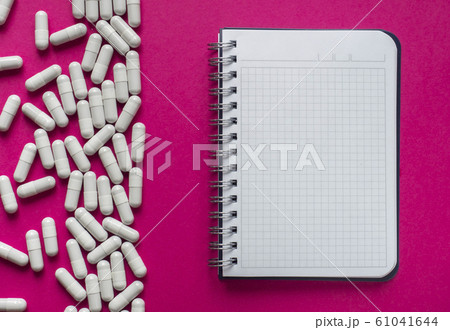 Pills and notebook 61041644