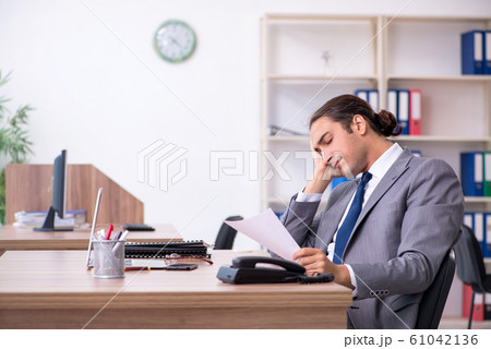 Unhappy male businessman in the office 61042136