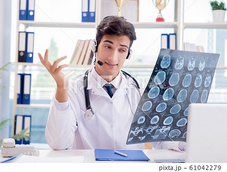 Young male doctor in telehealth concept Young male doctor in telehealth concept 61042279