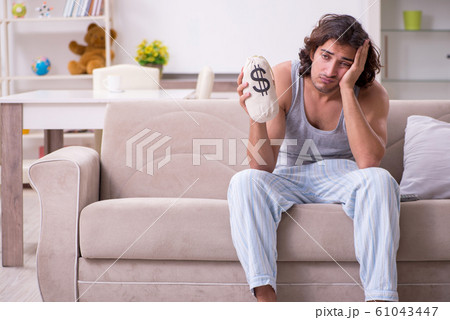 Unemployed man desperate at home Unemployed man desperate at home 61043447