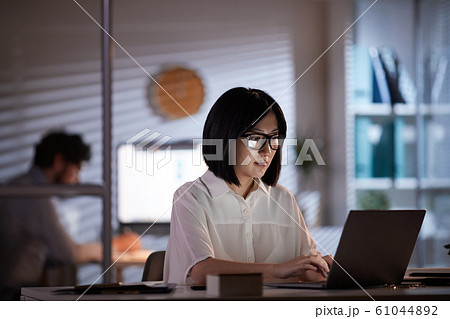 Asian woman working on laptop 61044892