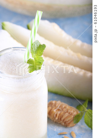 Melon drink decorated with mint leaves.  61046193