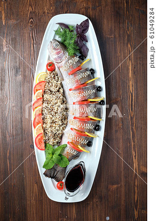 Stuffed fish with vegetables and rice. catering menu 61049284