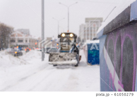 blurred background - city during snowfall and snow 61050279