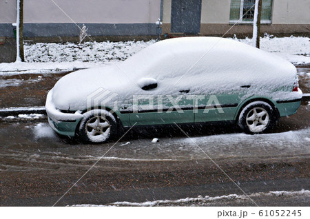 Snow on car after snowfall. Snow on car after snowfall. 61052245