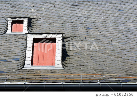 Roof covered with natural black slate tiles. Roof covered with natural black slate tiles. 61052256