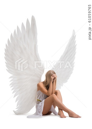 Sad woman with beautiful wings isolated view Sad woman with beautiful wings isolated view 61059765