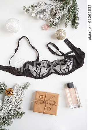 Black lace lingerie and perfume bottle. Top view. Gift set of women's accessories and underwear Black lace lingerie and perfume bottle. Top view. Gift set of women's accessories and underwear 61062655