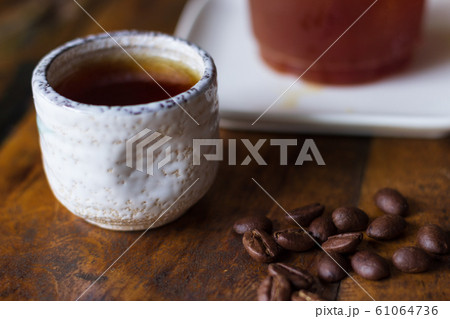 A Small Cup of Hot Tea on the Table There is a A Small Cup of Hot Tea on the Table There is a 61064736