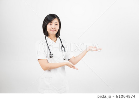 Young asian nurse with a stethoscope isolated over white background. 61064974
