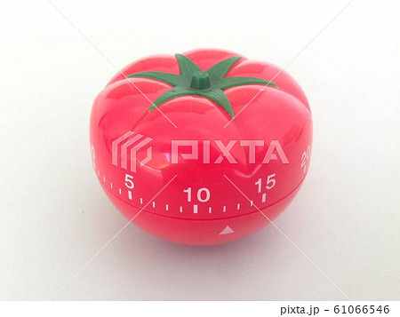 Pomodoro Timer red with green details. Tomato on the table. Vibrant, multi-angle colors. 61066546