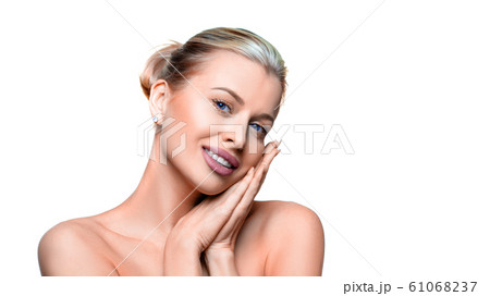 Portrait of blue eyed attractive woman over white background. Portrait of blue eyed attractive woman over white background. 61068237