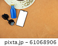 Top view sunglasses and sunscreen lotion with mobile phone, copy space	 61068906