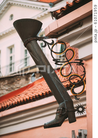 Tallinn, Estonia. Gutter In The Shape Of A Long Boot On The Long Leg Street Or Pikk Jalg Tallinn, Estonia. Gutter In The Shape Of A Long Boot On The Long Leg Street Or Pikk Jalg 61071959
