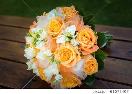 Bridal bouquet with orange and white flowers Bridal bouquet with orange and white flowers 61072407