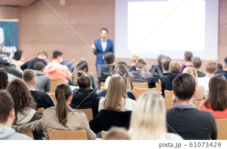 Business speaker giving a talk at business conference event. 61073429