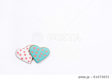 Gingerbread cookies with frosting in the shape of a heart. Gingerbread cookies with frosting in the shape of a heart. 61073655