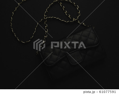 Black leather bag with golden chain 61077591