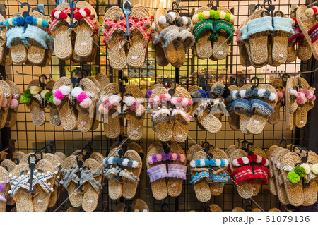 Colorful handicraft shoes selling at the market  61079136