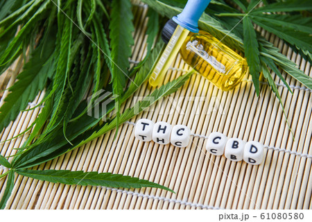Cannabis oil in bottle products on wooden 61080580