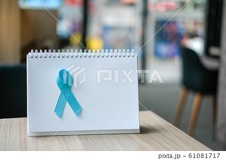 Prostate Cancer Awareness month (November), light Blue Ribbon on white paper for supporting people living and illness. Men Healthcare and World cancer day concept with copy space for your text Prostate Cancer Awareness month (November), light Blue Ribbon on white paper for supporting people living and illness. Men Healthcare and World cancer day concept with copy space for your text 61081717