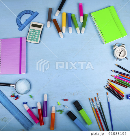 Items for the school on a wooden table. Items for the school on a wooden table. 61083195