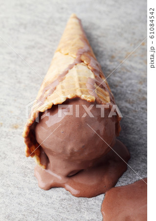 chocolate ice cream cones dropped melt on ground chocolate ice cream cones dropped melt on ground 61084542