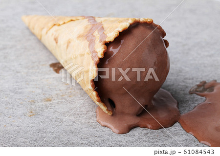 chocolate ice cream cones dropped on ground chocolate ice cream cones dropped on ground 61084543