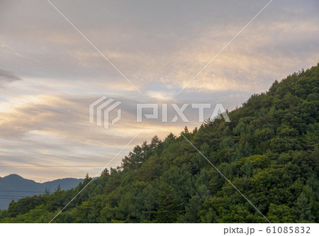 Evening clouds with tree mountain 61085832