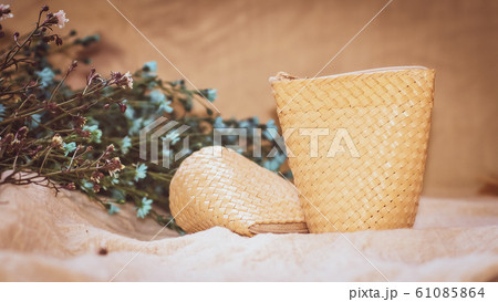 Set of Empty wicker basket on the table with background in natural linen and green plant,Template mock up for display of product 61085864