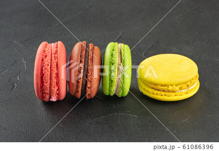 Four multicolored macaroons 61086396