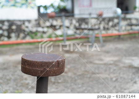 Diy metal iron dumbbell on a outdoor fitness gym floor Diy metal iron dumbbell on a outdoor fitness gym floor 61087144