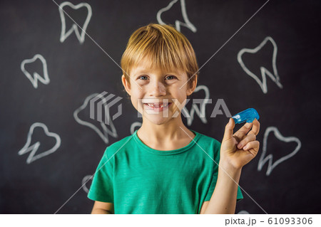 Six-year old boy shows myofunctional trainer. Helps equalize the growing teeth and correct bite Six-year old boy shows myofunctional trainer. Helps equalize the growing teeth and correct bite 61093306