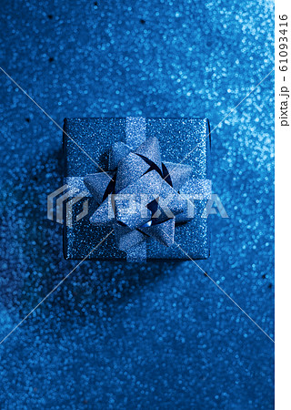 Bright modern box in blue shiny wrapping paper 61093416