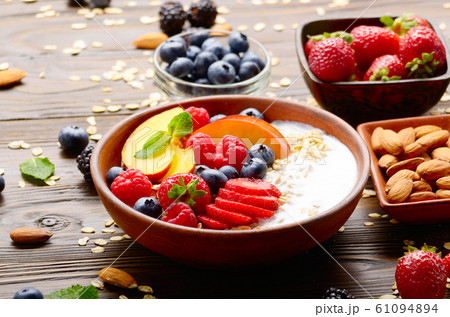 Fruit healthy muesli with peaches strawberry 61094894