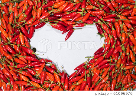 Fresh organic vegetable red hot chili pepper heart Fresh organic vegetable red hot chili pepper heart 61096976