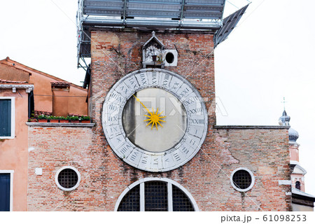 The clock of the "San Giacometto in Rialto" church located in Venice in the San Polo neighborhood closed to the famous bridge. This church is believed to be the oldest in Venice The clock of the "San Giacometto in Rialto" church located in Venice in the San Polo neighborhood closed to the famous bridge. This church is believed to be the oldest in Venice 61098253