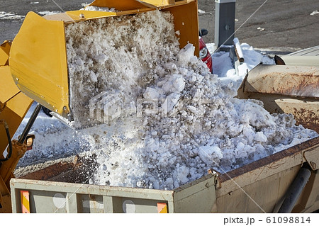 Loader removing snow from street 61098814