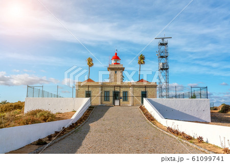 Lighthouse for orienting ships on the cape Ponta de Piedade Lagos, Portugal. Lighthouse for orienting ships on the cape Ponta de Piedade Lagos, Portugal. 61099741