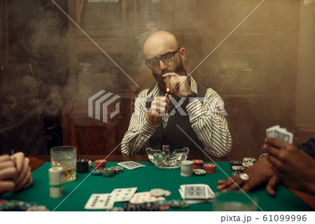 Bearded poker player with cigar, casino 61099996