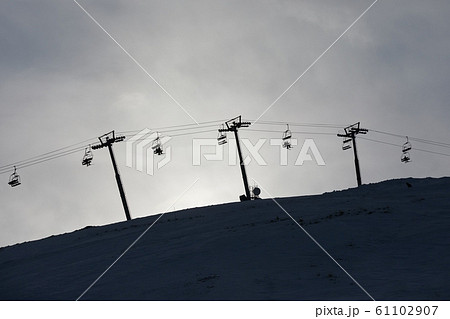 Ski lift cloudy sky silhouette Ski lift cloudy sky silhouette 61102907