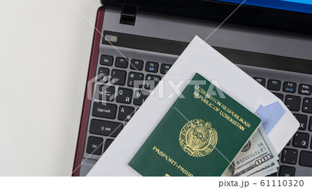 Passport of Uzbekistan on the keyboard 61110320