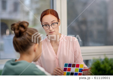 School psychologist giving different tests to a pupil School psychologist giving different tests to a pupil 61110601