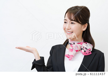 ビジネスウーマン 若い女性 白バック スーツ スカーフの写真素材